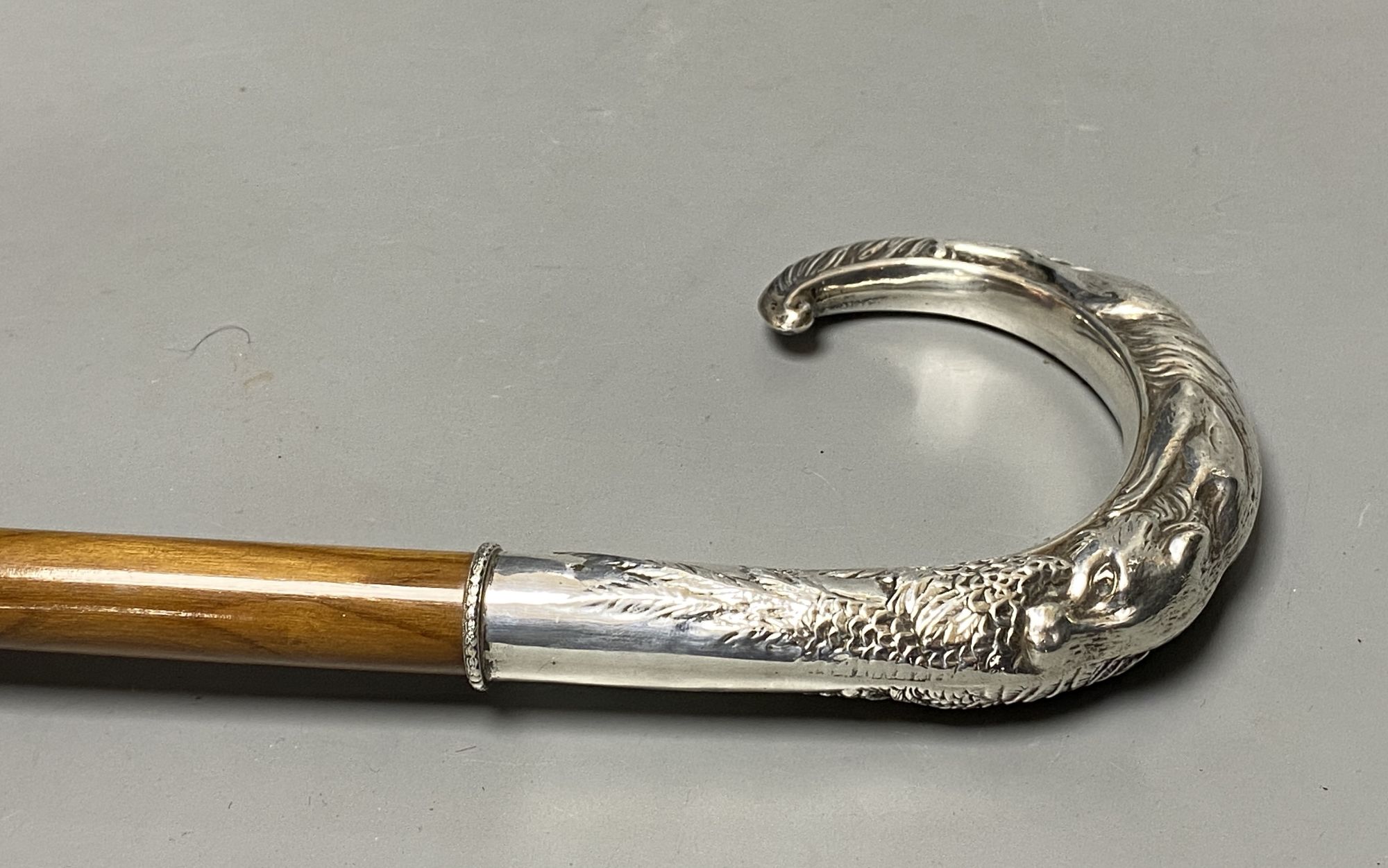 A modern 1980s silver mounting wooden walking cane, the handle decorated with hunting hound and game bird, 88.5cm